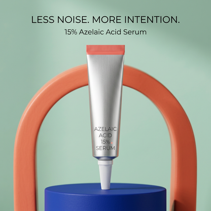 Silver serum tube displayed on cobalt podium with coral arch